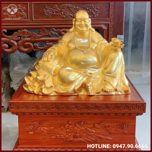Tượng Phật Di Lặc bằng đồng cầm thỏi vàng