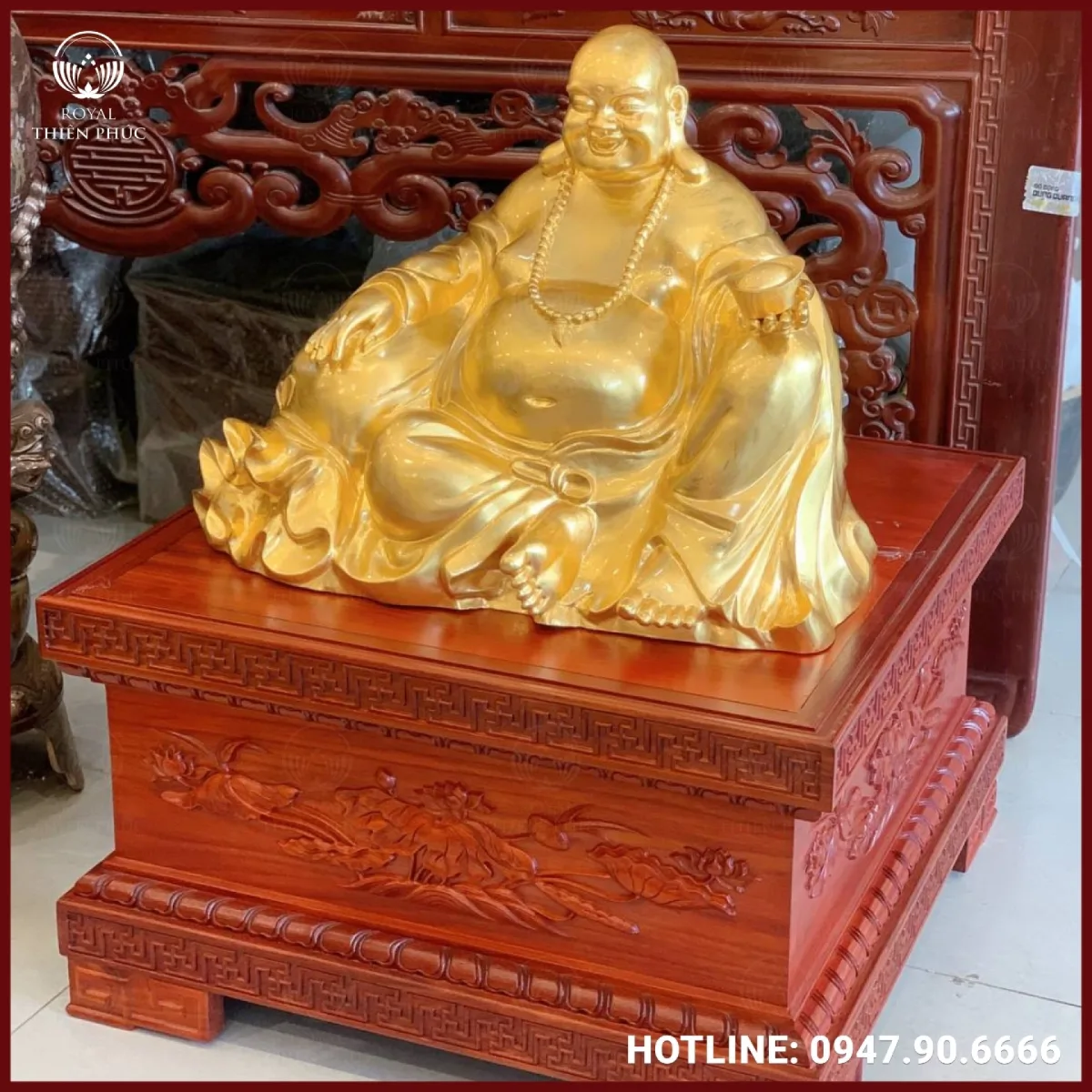 Tượng Phật Di Lặc bằng đồng cầm thỏi vàng